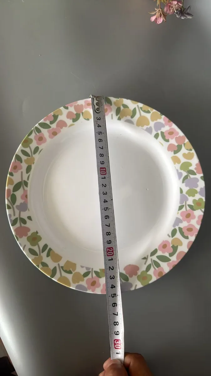 Measuring the diameter of a floral melamine plate